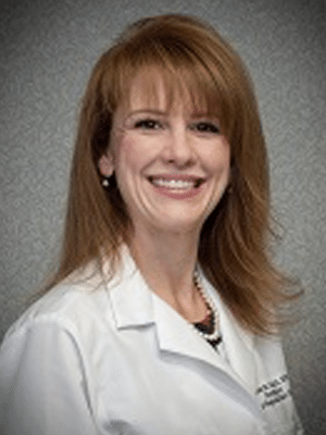 a person smiling for the camera